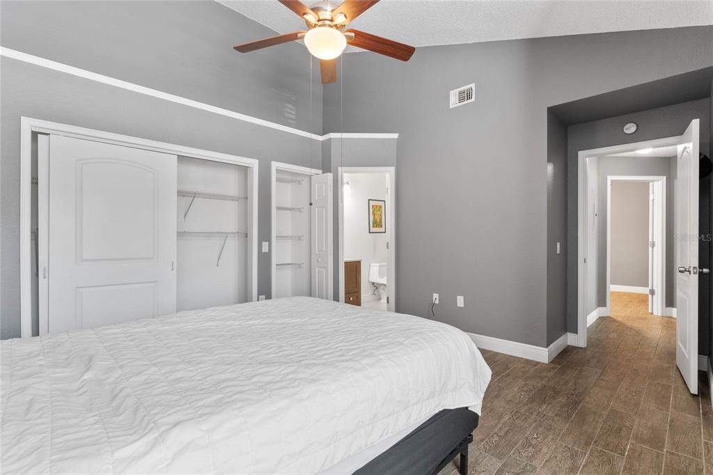 660 Youngstown Parkway, Unit 282 Altamonte Springs, FL 32714 - Photo 15 of 22 a bedroom with a large bed and a chandelier