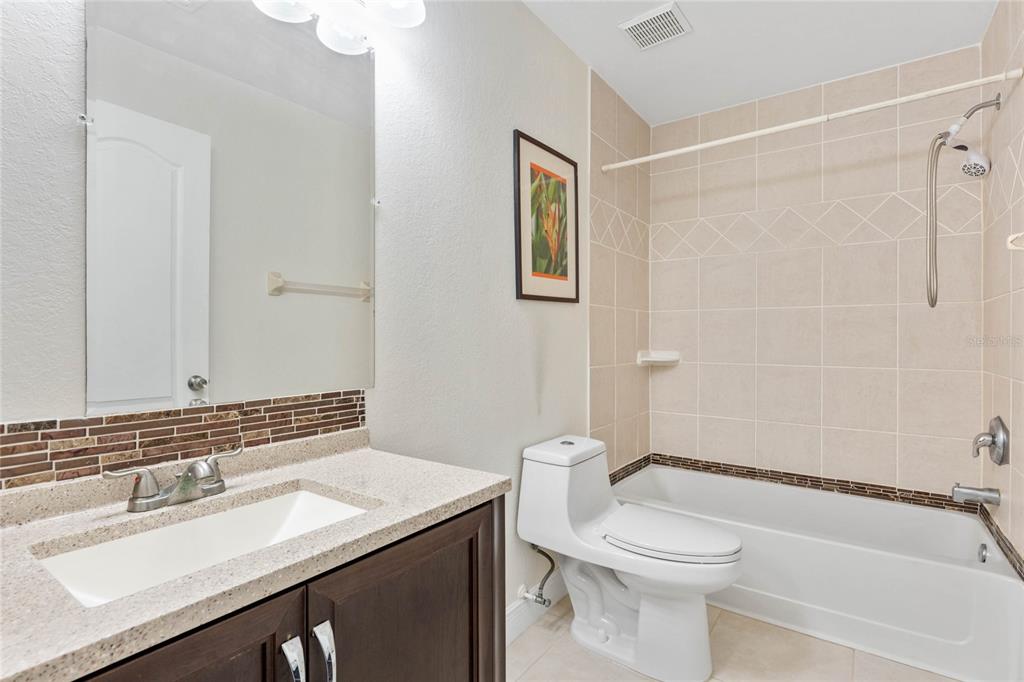 660 Youngstown Parkway, Unit 282 Altamonte Springs, FL 32714 - Photo 16 of 22 a bathroom with a sink a toilet and shower