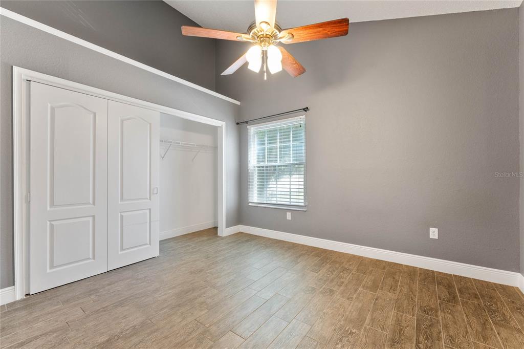 660 Youngstown Parkway, Unit 282 Altamonte Springs, FL 32714 - Photo 18 of 22 an empty room with windows and fan