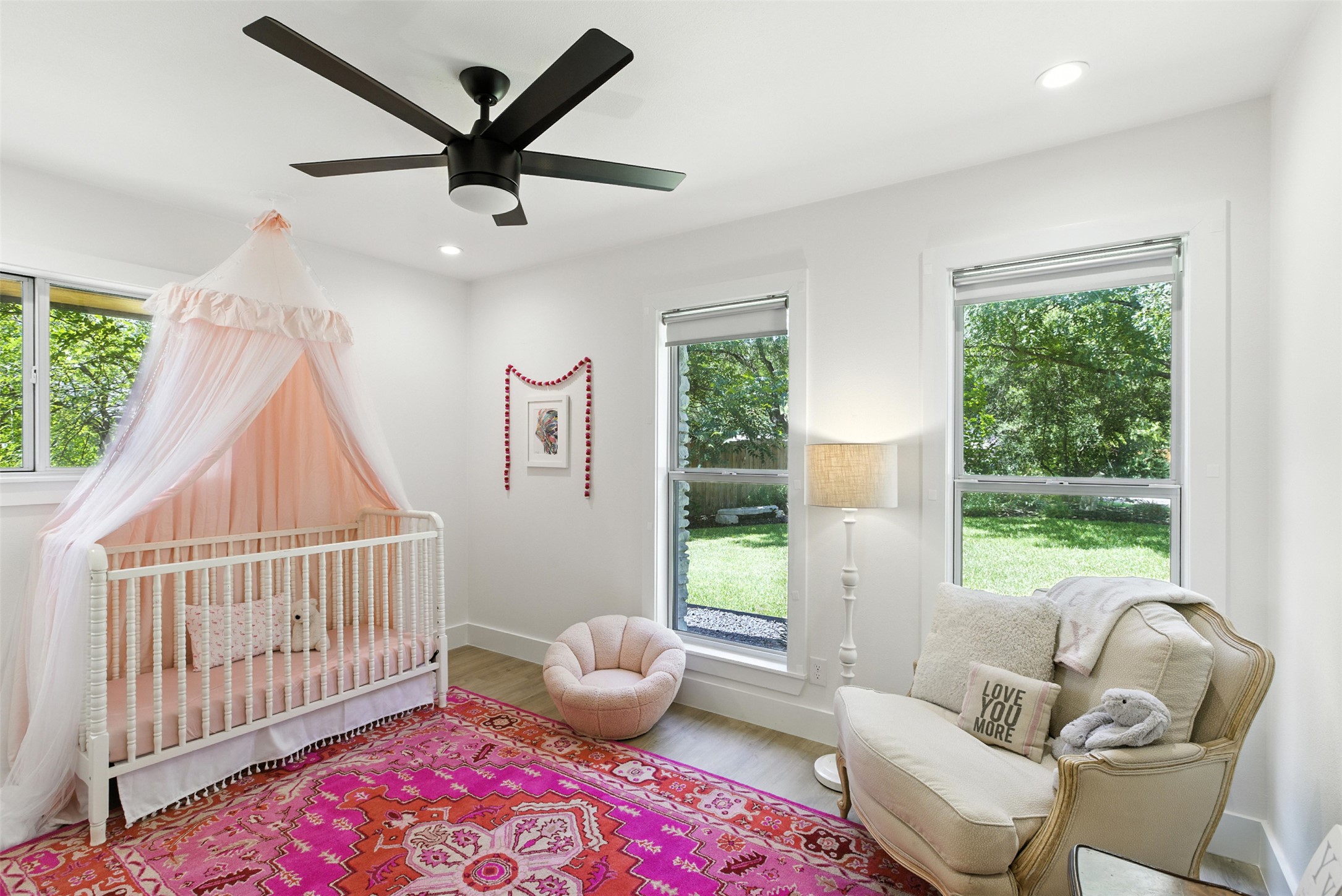 2403 Gateshead Circle Austin, TX 78745 - Photo 14 of 22 A charming bedroom with abundant natural light features recessed lighting and a ceiling fan for comfort.