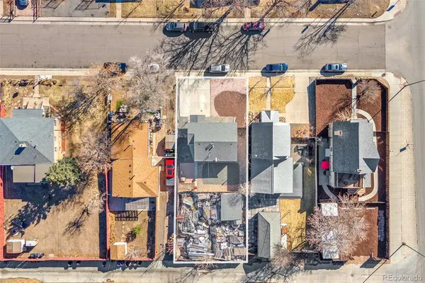 an aerial view of residential houses with outdoor space