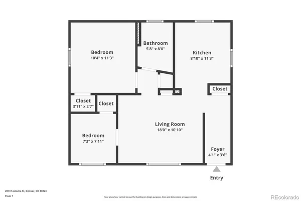 a kitchen with white cabinets sink and stove