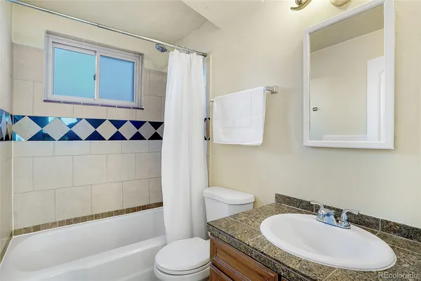 a view of an empty room with stairs and stairs