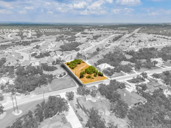 an aerial view of residential building with parking space