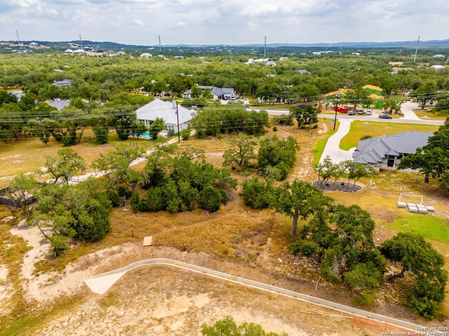 34848 Thanksgiving Trail Bulverde, TX 78163 - Photo 18 of 20 an aerial view of residential houses with outdoor space