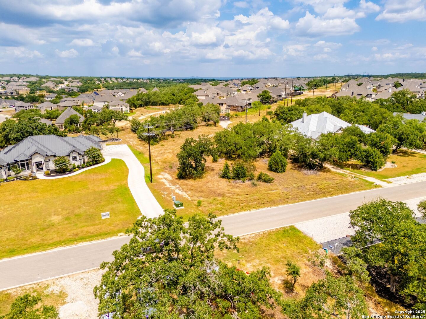 34848 Thanksgiving Trail Bulverde, TX 78163 - Photo 3 of 20 a view of a swimming pool with an ocean view