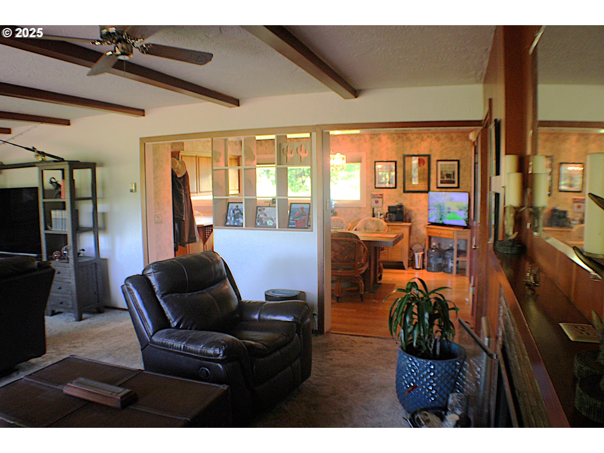 180 Ruckles Drive Myrtle Creek, OR 97457 - Photo 11 of 45 a living room with furniture and large windows