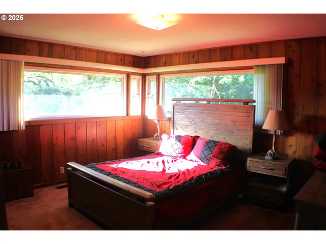 a bedroom with a bed and a view of bedroom