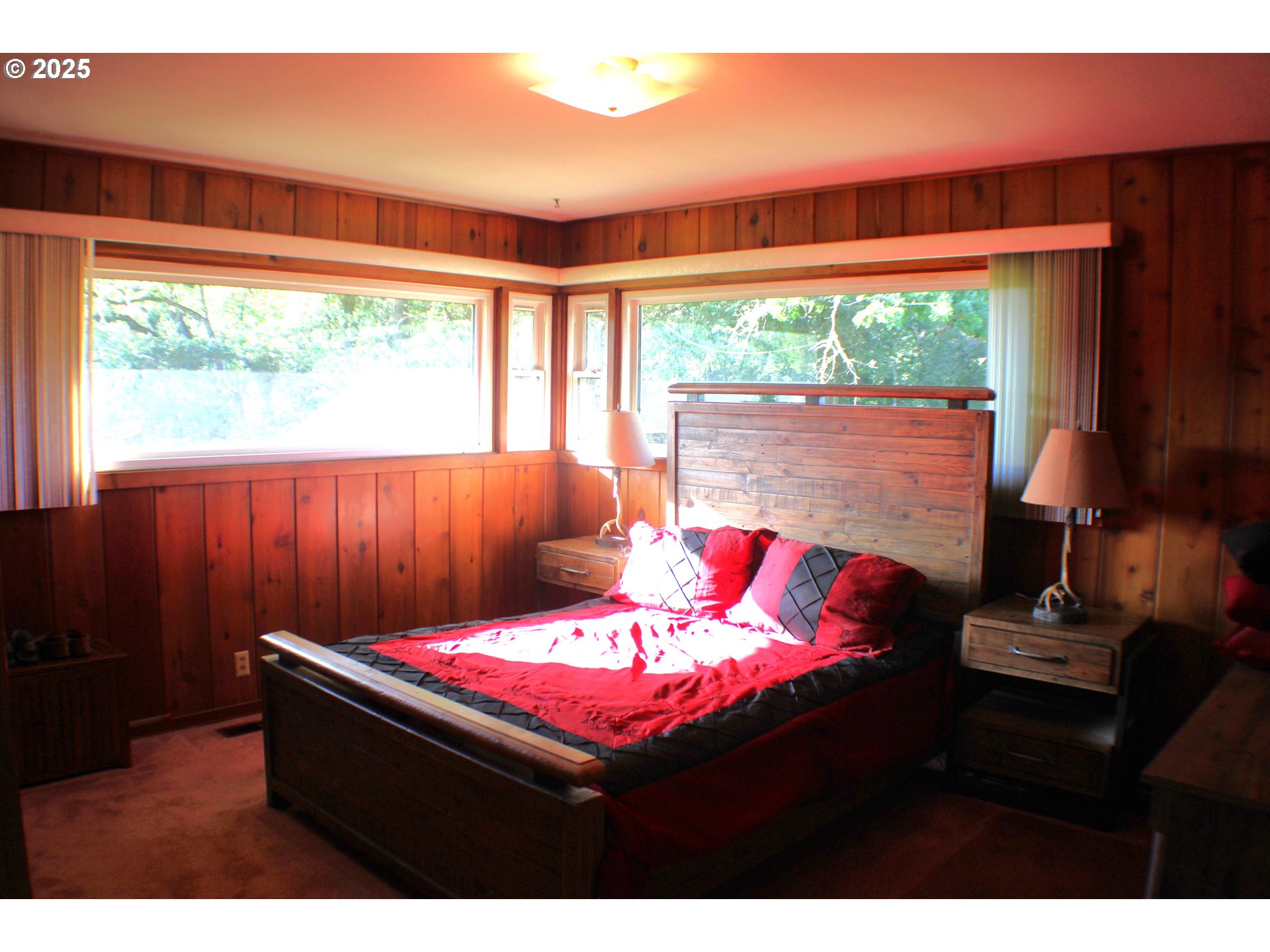 180 Ruckles Drive Myrtle Creek, OR 97457 - Photo 21 of 45 a living room with a large window with yard