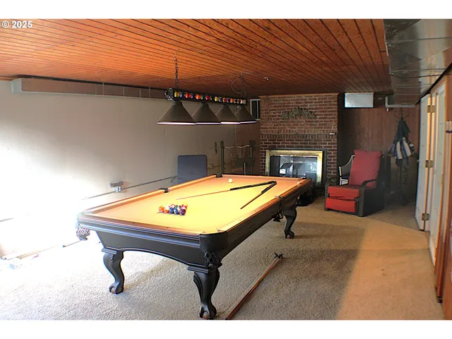 a view of sitting area with furniture and wooden floor