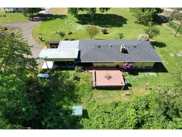 an aerial view of houses with yard