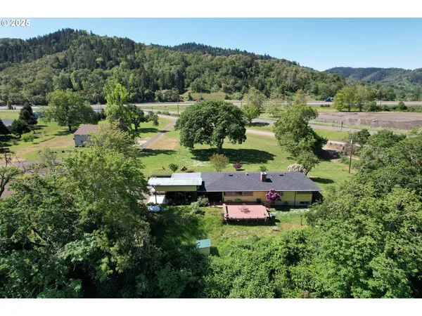 a view of a house with a mountain in the background