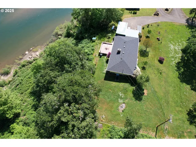a backyard of a house with table and chairs