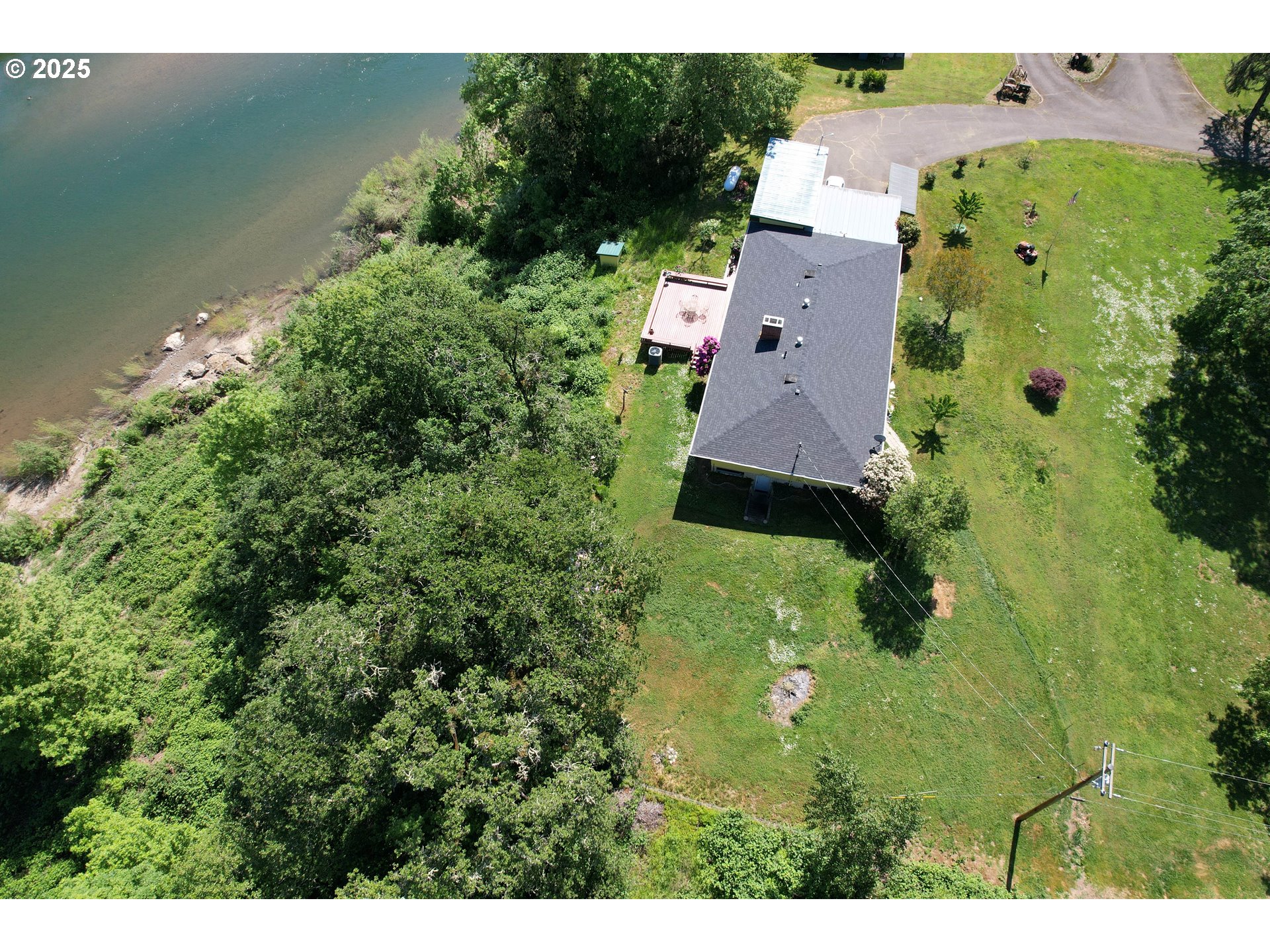 180 Ruckles Drive Myrtle Creek, OR 97457 - Photo 31 of 45 an aerial view of houses with yard