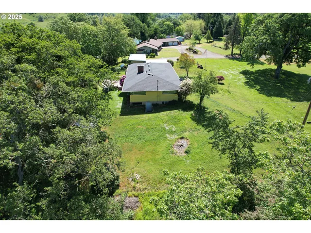 a view of a yard with a lake view