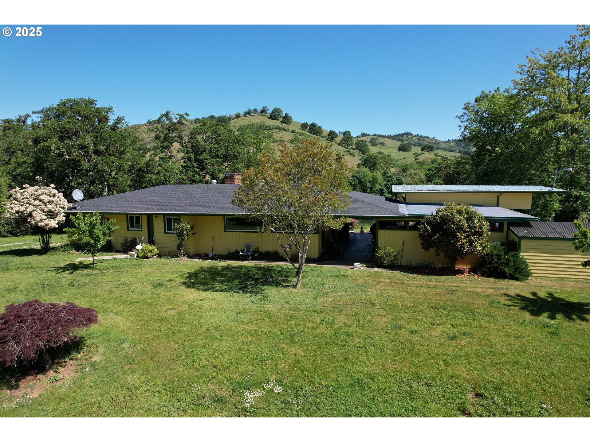 180 Ruckles Drive Myrtle Creek, OR 97457 - Photo 38 of 45 a view of a house with a yard