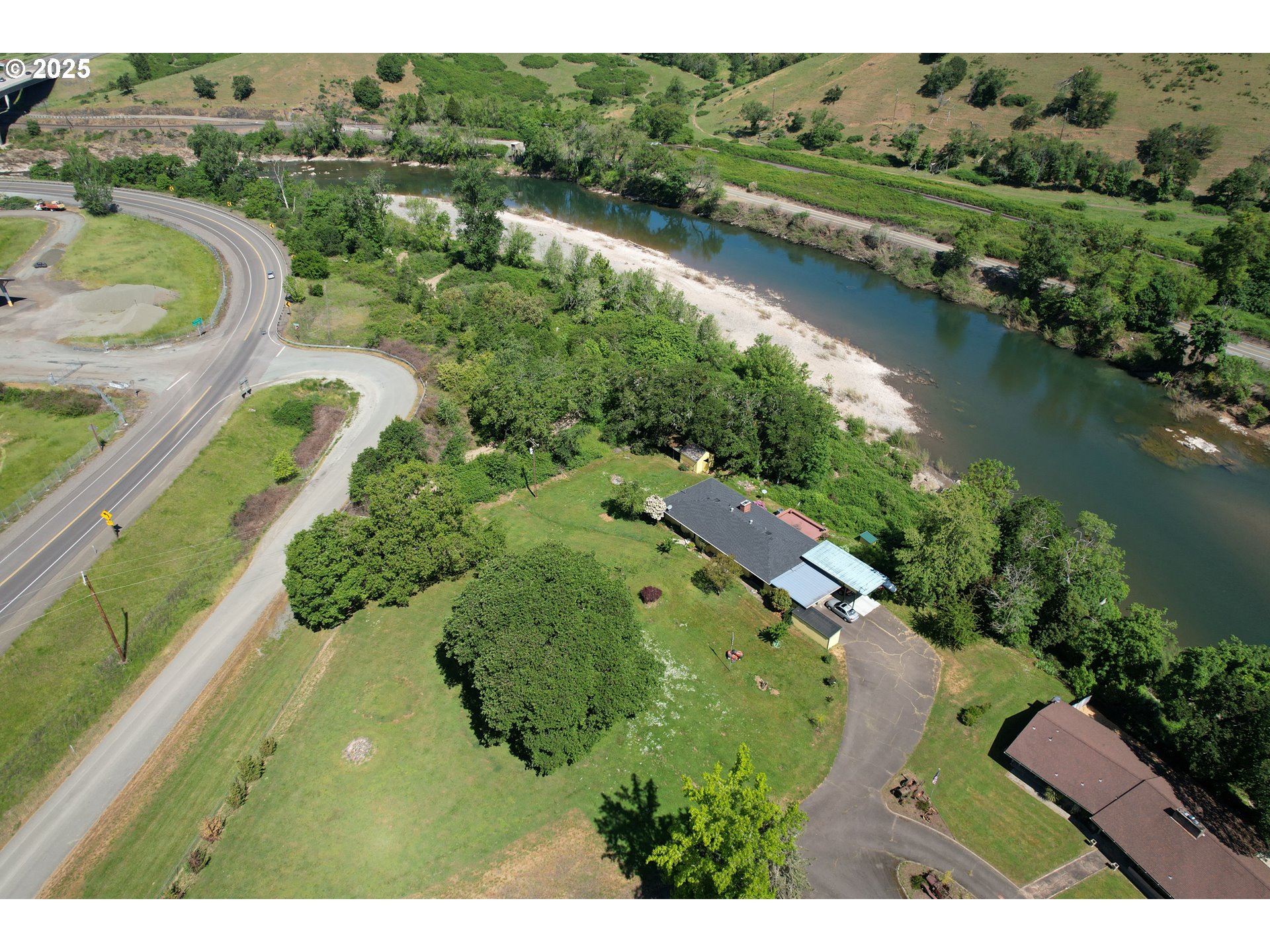 180 Ruckles Drive Myrtle Creek, OR 97457 - Photo 40 of 45 an aerial view of lake residential house with outdoor space and trees