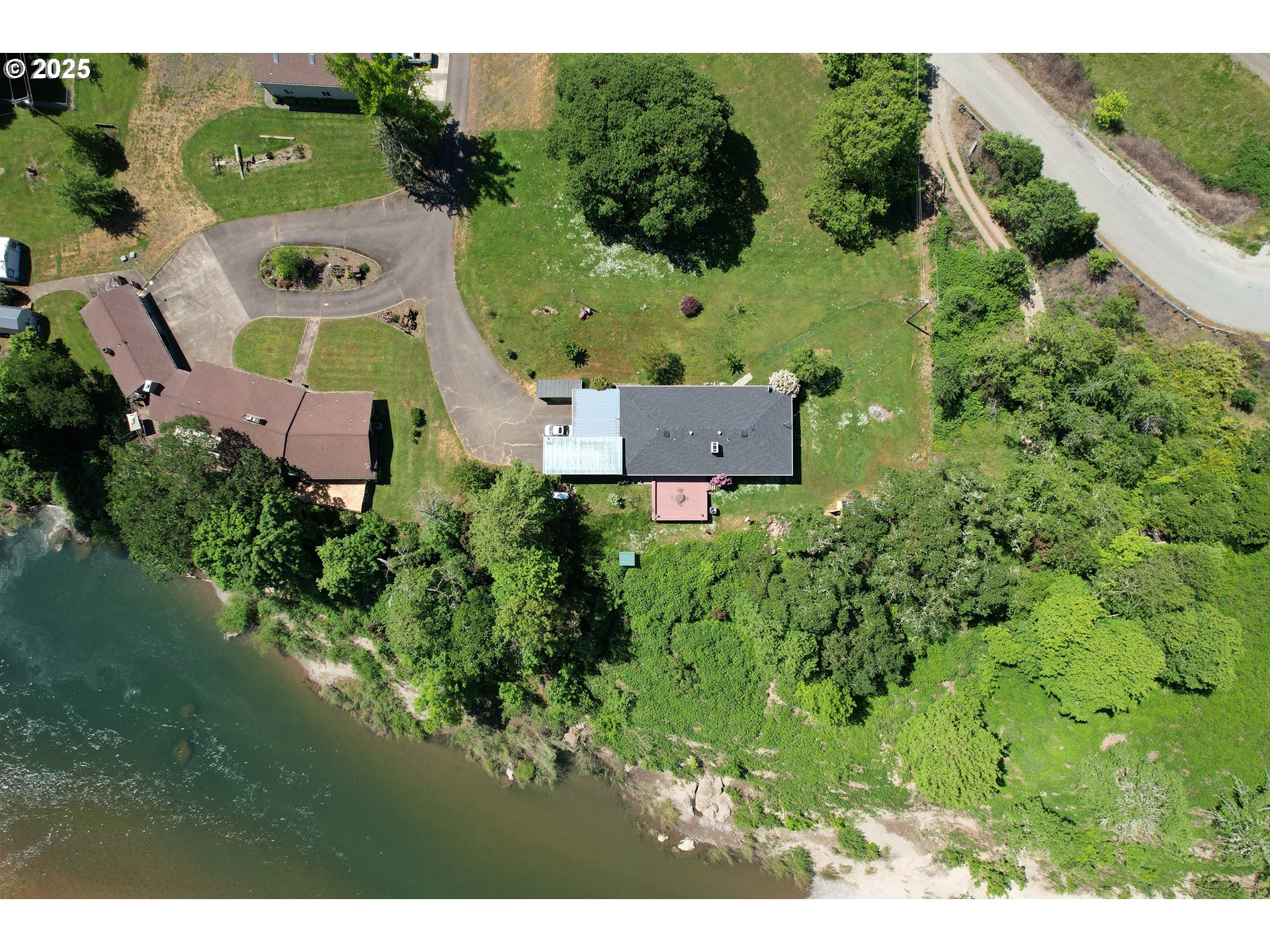 180 Ruckles Drive Myrtle Creek, OR 97457 - Photo 4 of 45 an aerial view of a house with a garden