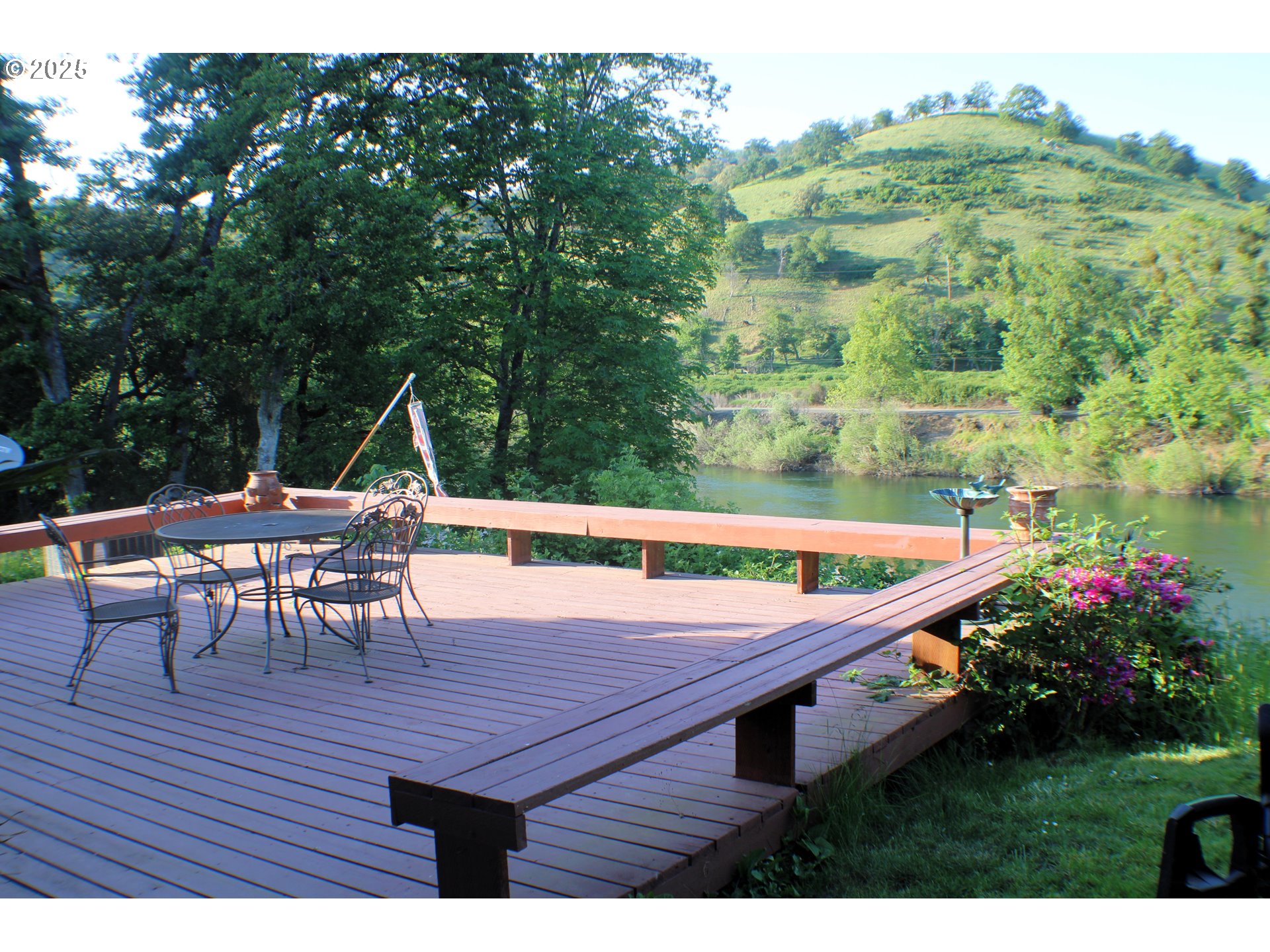 180 Ruckles Drive Myrtle Creek, OR 97457 - Photo 5 of 45 a view of a chairs and table on the wooden deck