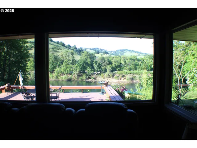a view of a floor to ceiling window and an outdoor view