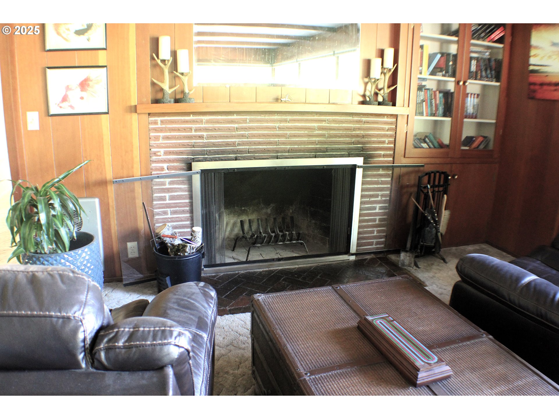 180 Ruckles Drive Myrtle Creek, OR 97457 - Photo 10 of 45 a living room with furniture and a fireplace