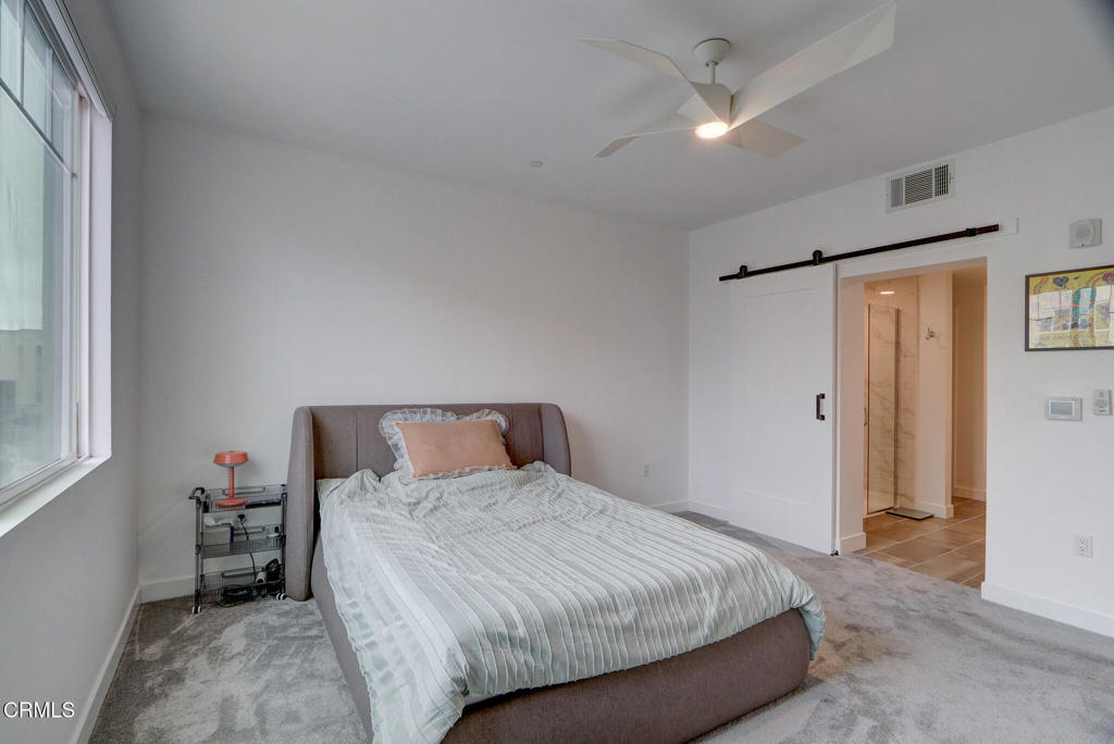 2810 Wagon Wheel Road, Unit 304 Oxnard, CA 93036 - Photo 14 of 36 a bedroom with a bed and a window