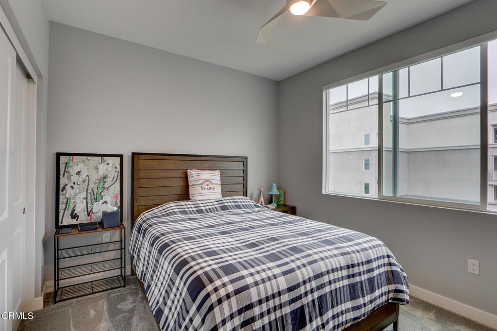 2810 Wagon Wheel Road, Unit 304 Oxnard, CA 93036 - Photo 21 of 36 a bedroom with a bed and window