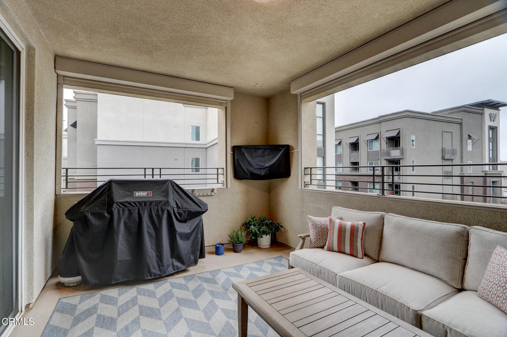 2810 Wagon Wheel Road, Unit 304 Oxnard, CA 93036 - Photo 27 of 36 a view of living room and kitchen with furniture