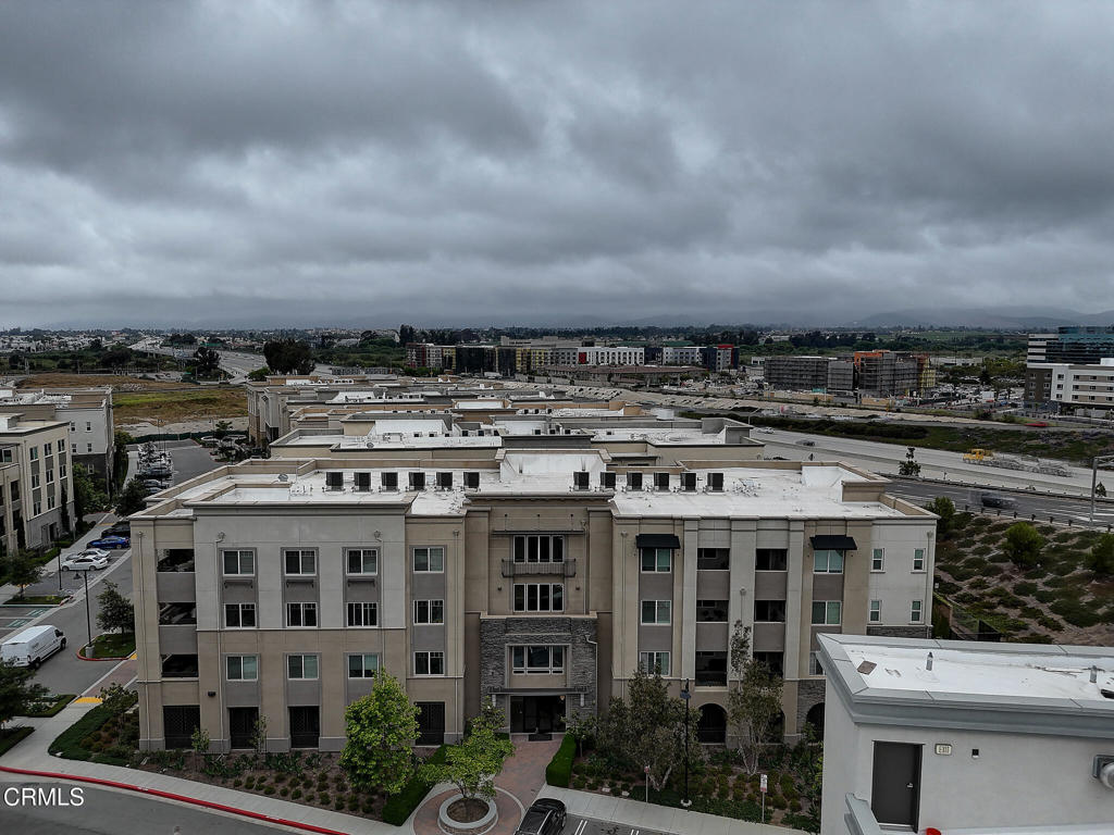 2810 Wagon Wheel Road, Unit 304 Oxnard, CA 93036 - Photo 30 of 36 a large building with a city view