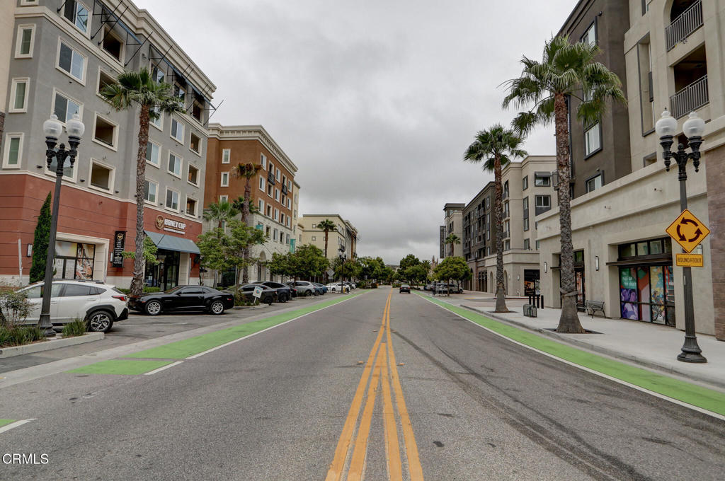 2810 Wagon Wheel Road, Unit 304 Oxnard, CA 93036 - Photo 34 of 36 a city street lined with buildings and cars