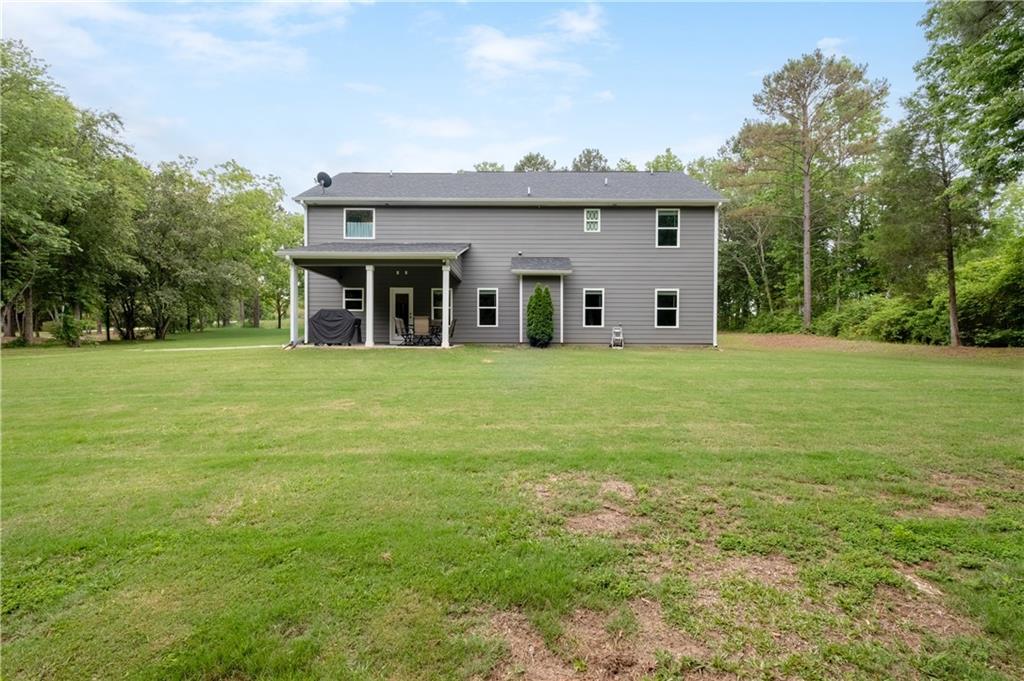 719 Fairview Road Brooks, GA 30205 - Photo 32 of 35 a front view of a house with a yard and trees