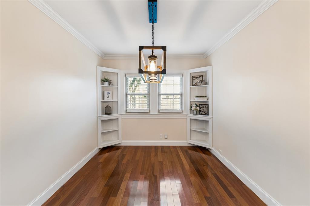 2427 Alco Avenue Dallas, TX 75211 - Photo 12 of 26 a view of empty room with wooden floor and window
