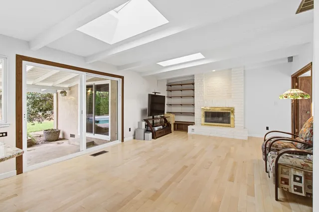 a bedroom with furniture and a flat screen tv