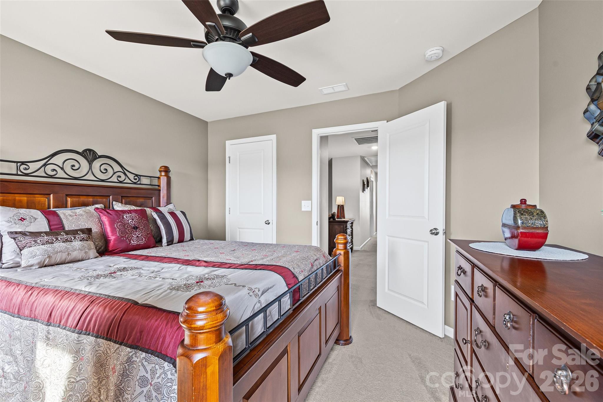 909 Cobbled Way Fort Mill, SC 29715 - Photo 16 of 31 a bedroom with a bed and a dresser