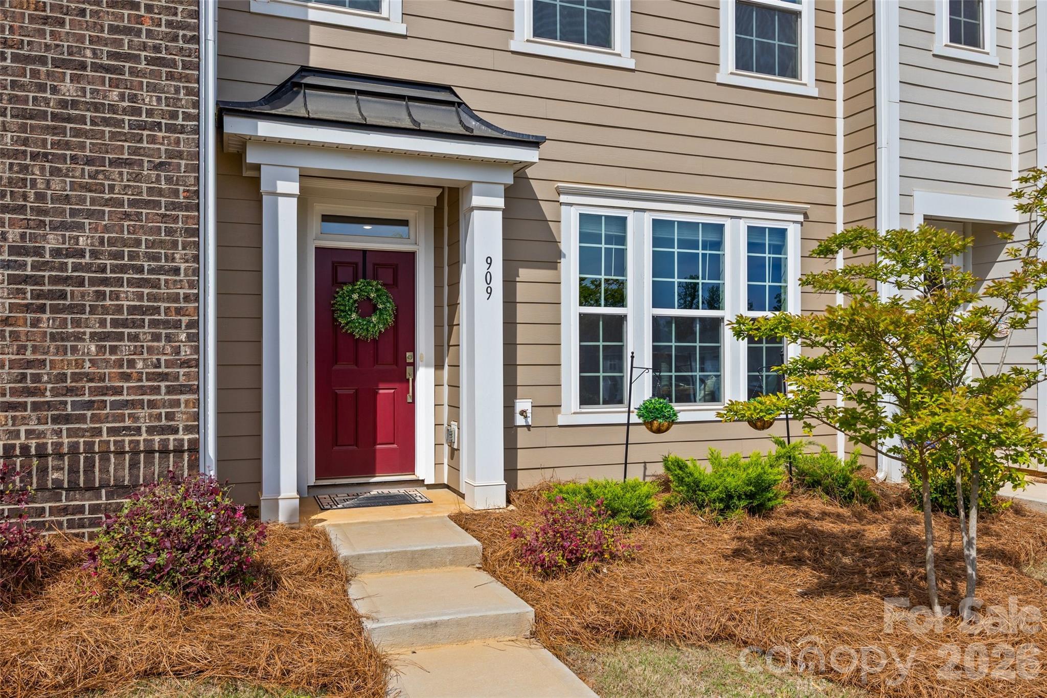 909 Cobbled Way Fort Mill, SC 29715 - Photo 2 of 31 a front view of a house with a yard