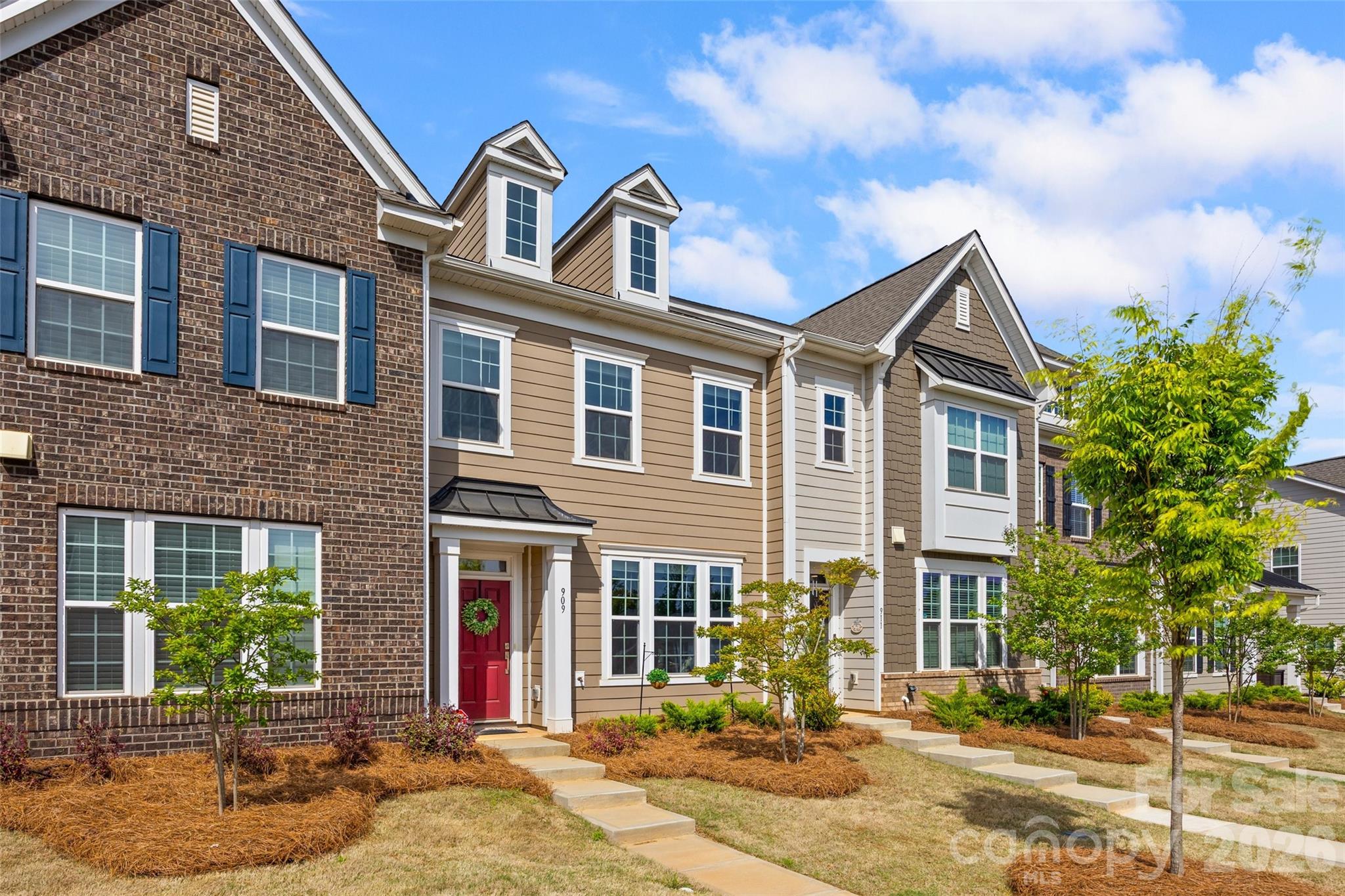909 Cobbled Way Fort Mill, SC 29715 - Photo 26 of 31 a front view of a house with a yard