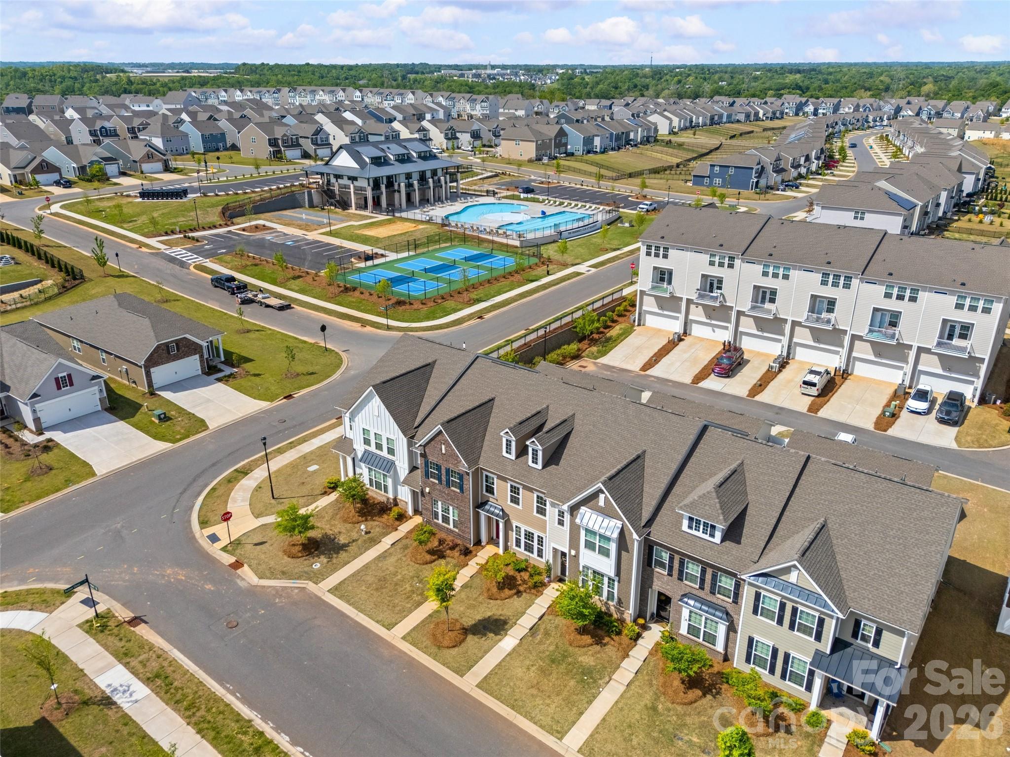 909 Cobbled Way Fort Mill, SC 29715 - Photo 27 of 31 an aerial view of a city with lawn chairs