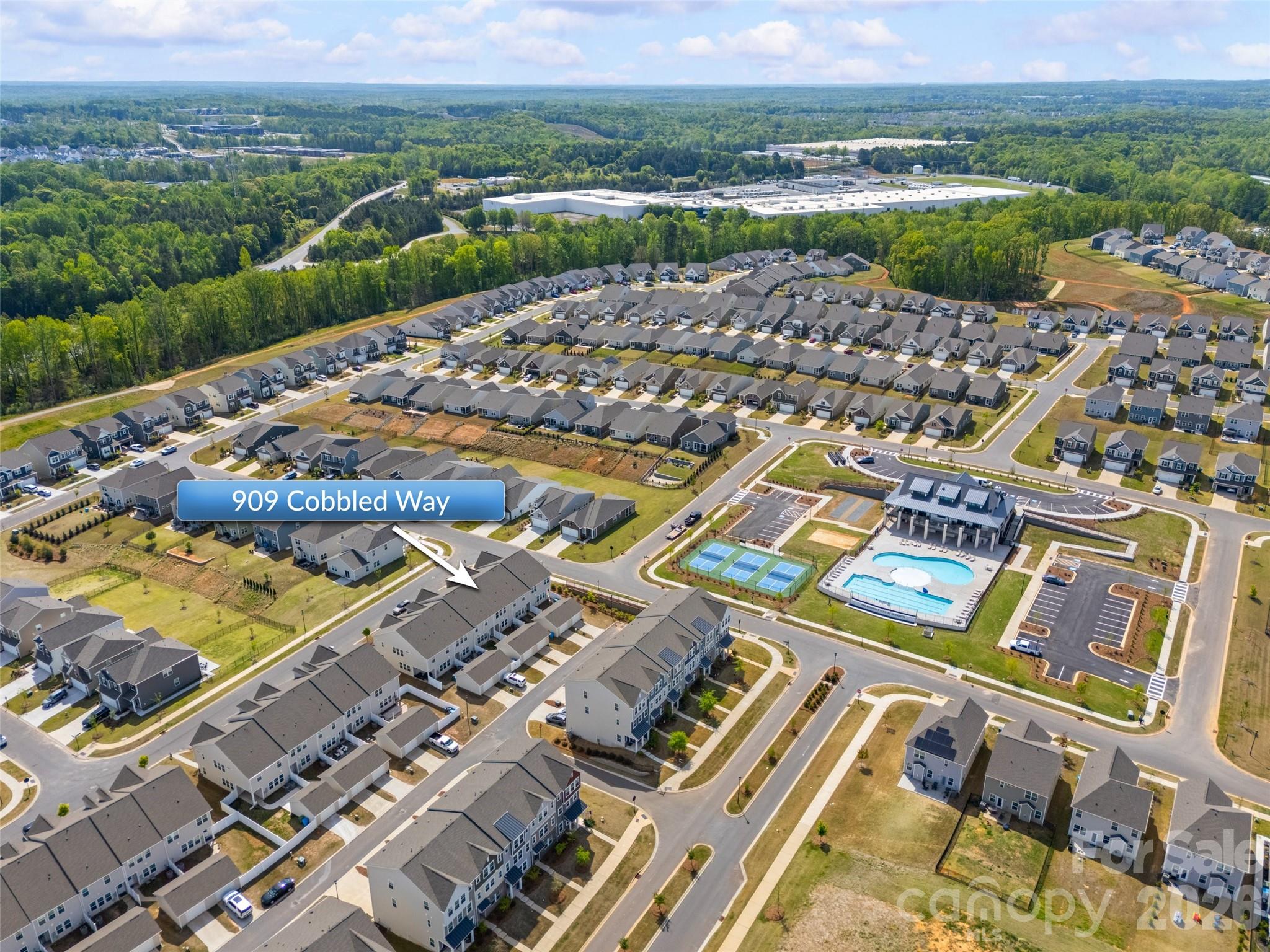 909 Cobbled Way Fort Mill, SC 29715 - Photo 30 of 31 an aerial view of a city with lots of residential buildings and mountain view in back