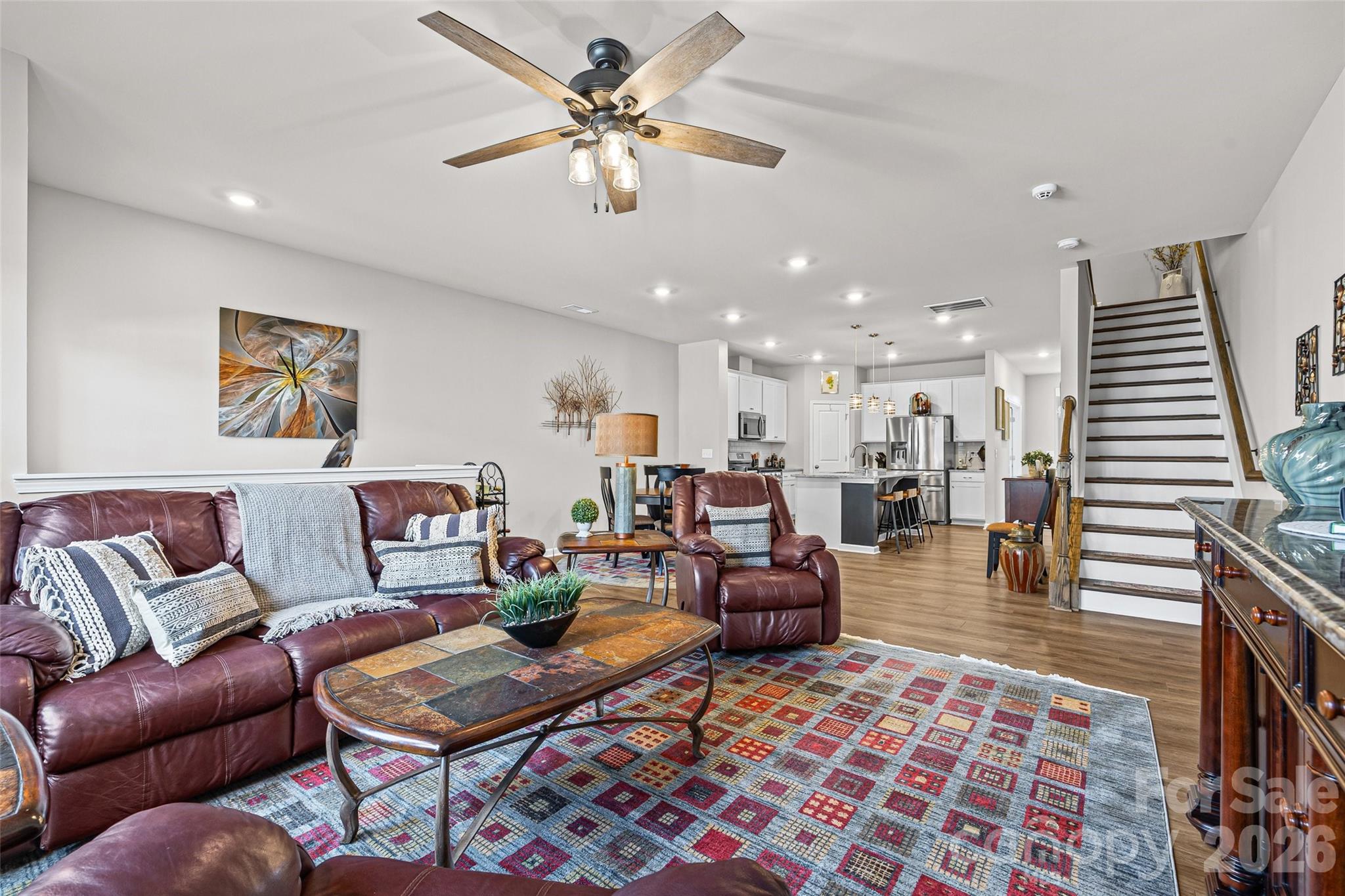 909 Cobbled Way Fort Mill, SC 29715 - Photo 10 of 31 a living room with furniture a flat screen tv and a table