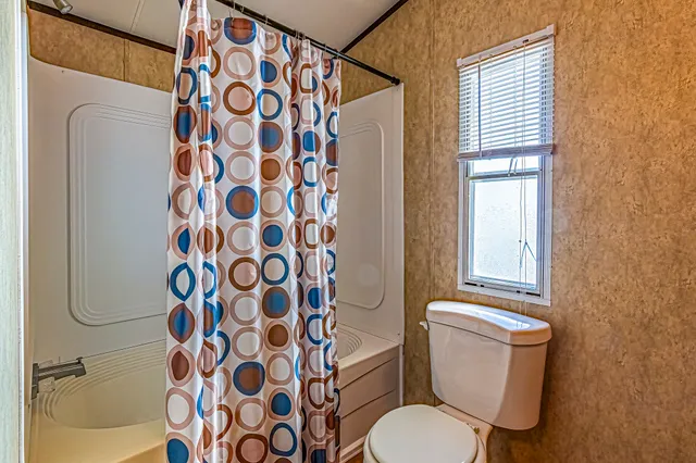 a view of a livingroom with furniture and window