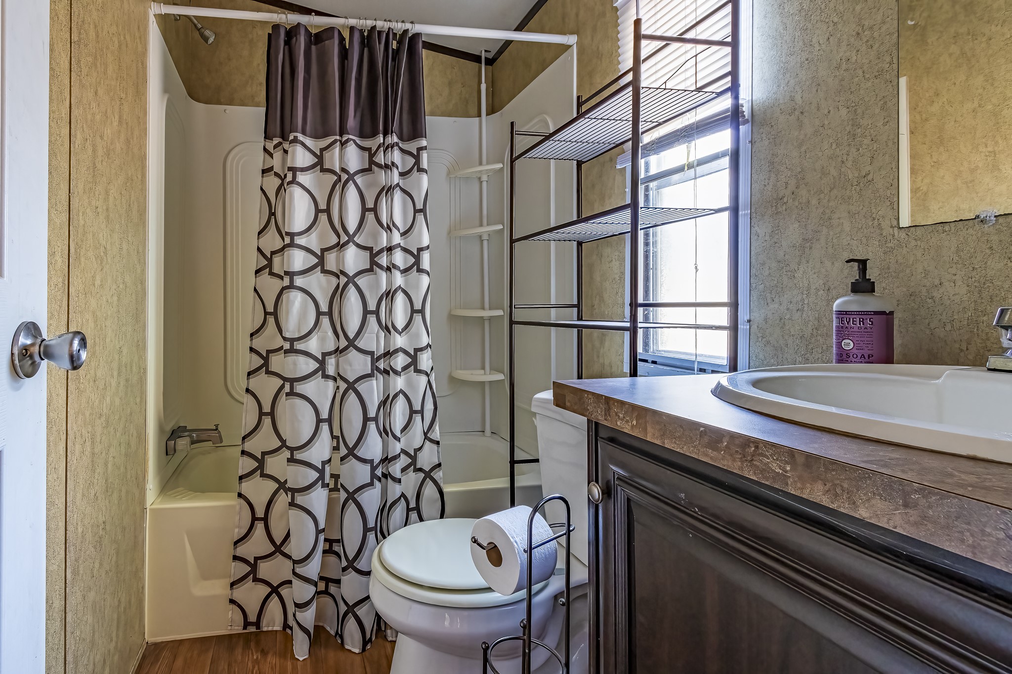 210 Rain Forest Road Onalaska, TX 77360 - Photo 24 of 26 a bathroom with a granite countertop sink toilet and shower