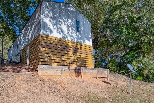 a view of house with backyard