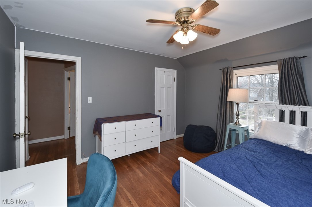 2469 Queenston Road Cleveland, OH 44118 - Photo 19 of 37 Bedroom featuring ceiling fan, baseboards, wood finished floors, and vaulted ceiling