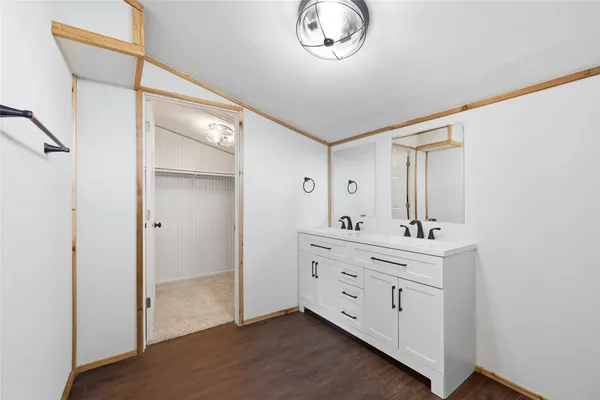 a room with a dresser and a mirror