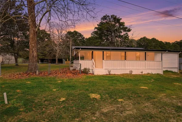 a view of backyard with green space