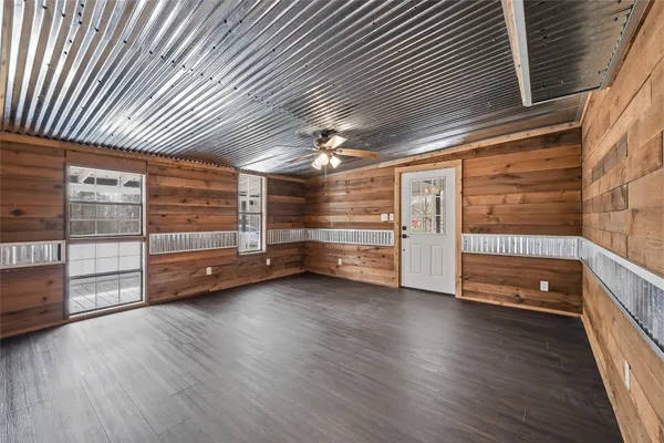 a view of a room with wooden walls