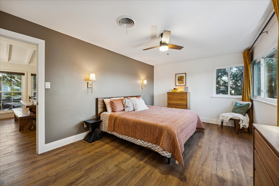 6407 Lynn Lane Lago Vista, TX 78645 - Photo 13 of 32 a bedroom with a bed and wooden floor