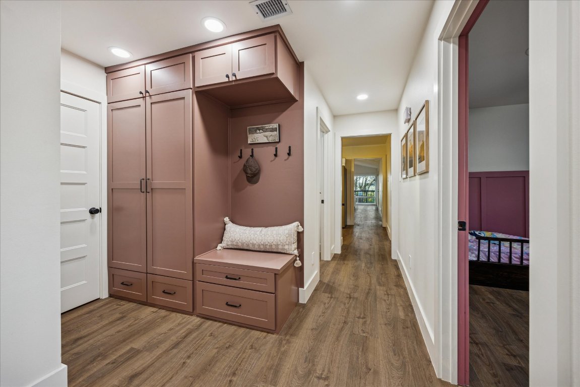 6407 Lynn Lane Lago Vista, TX 78645 - Photo 15 of 32 a room with wooden floor and furniture