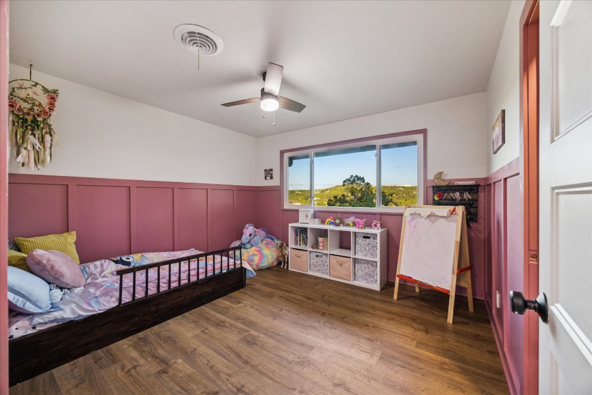 6407 Lynn Lane Lago Vista, TX 78645 - Photo 17 of 32 a balcony with furniture and wooden floor