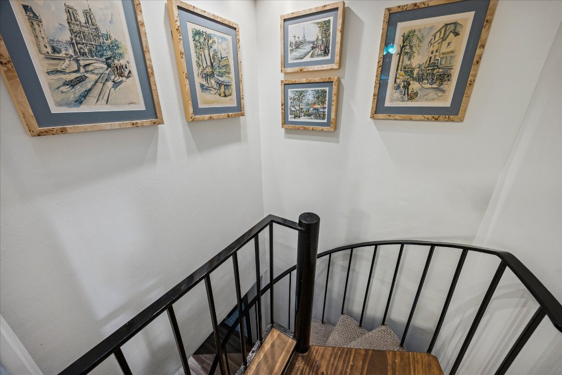 6407 Lynn Lane Lago Vista, TX 78645 - Photo 19 of 32 a view of a hallway with wooden floor